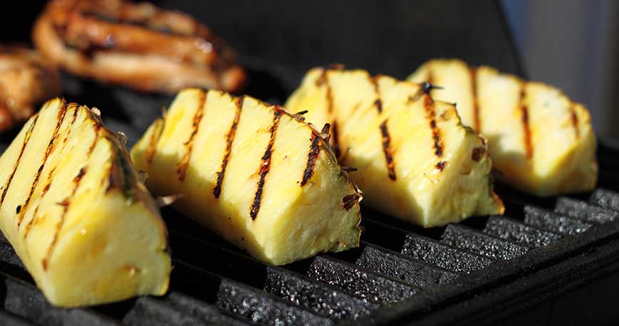 pineapple on a grill: one of the key ingredients for an easy fruit salad recipe